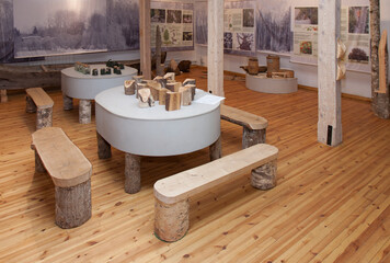 A display of wood and wooden objects, benches and tables in the Forest Museum at Sagadi manor.