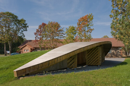 The Estonian Road Museum, a country park with a collection of buildings, a modern log cabin with sloping roof.
