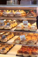 The counter of a pastry shop with pastries and cakes