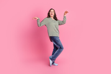 Full size photo of nice aged woman dancing wear shirt isolated on pink color background