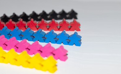 Wooden colorful figures of people on a white background. Concept of diversity and inclusion