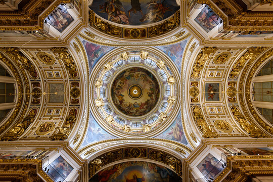 Saint Isaac's Cathedral, the 19th century cathedral interior, painted domes and wall panels and arches with plasterwork decorations.