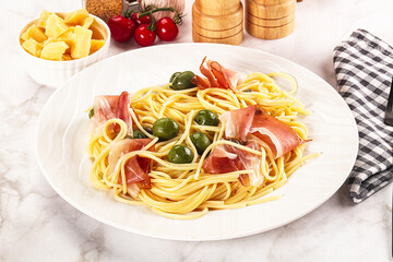 Pasta spaghetti with olives and jamon