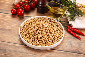 Dry chickpea seeds heap in the bowl