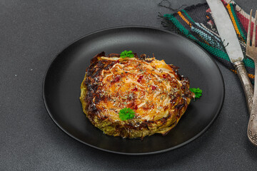 Homemade vegan cabbage steaks with herbs and spices. Healthy food ready to eat on a serving plate