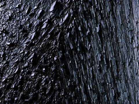 Argillite A dark argillite with a smooth slate like texture floating and lit to show