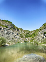 Fototapeta premium A wonderful landscape in the Carpathian mountains with a view of the lake between the rocks in sunny weather