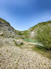 A wonderful landscape in the Carpathian mountains with a view of the lake between the rocks in sunny weather