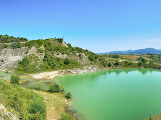 A wonderful landscape in the Carpathian mountains with a view of the lake between the rocks in sunny weather