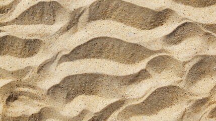 Beach sand texture background from top view, ideal for summer designs.