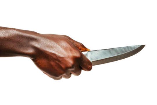 A dark-skinned hand holds a sleek, shiny knife against a white background. The light glints off the blade, emphasizing its sharp edge.