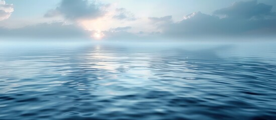 Fototapeta premium Calm Ocean Surface with a Misty Sky