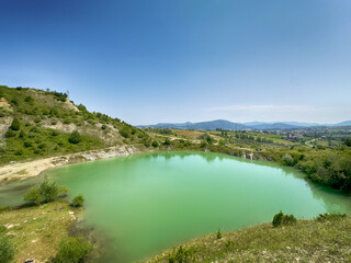 A wonderful landscape in the Carpathian mountains with a view of the lake between the rocks in sunny weather