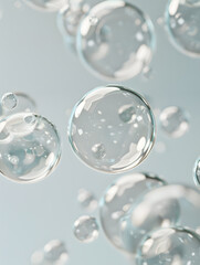 oil bubbles floating against a light background. The bubbles are semi-transparent with a reflective quality