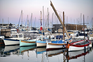 Boats at the port of Cannes at sunset, France