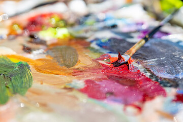 Obraz premium Artist's palette, close-up. Selective focus on the foreground. Background image