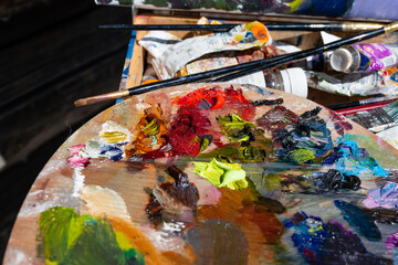 Artist's palette, close-up. Selective focus on the foreground. Background image