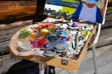 Artist's palette, close-up. Selective focus on the foreground. Background image