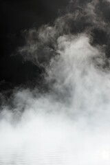 Obraz premium White smoke art on a pure black background, creating a striking and abstract visual effect...