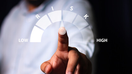 Businessman showing risk level indicator rating since low to high for risk management and assessment review concept. Business and finance concept, CEO manager management.