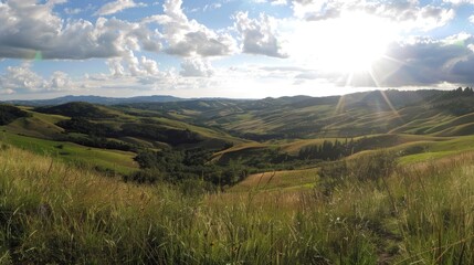 Obraz premium A panoramic view of rolling hills and valleys with a bright sky