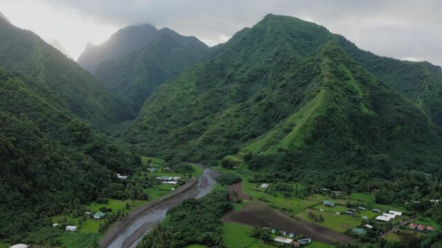 Teahupoo, Tahiti aerial drone view of the river in the valley of mountain Orohena Aorai Ronui. French Polynesia 2024 Paris Olympics surfing spot. Paradise in Pacific Ocean crystal waters. Moana Disney