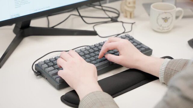 Over Shoulder Shot of White Woman Hands Typing on Mechanical Keyboard in Office