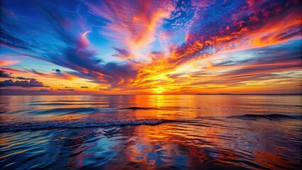 Vibrant sunset over the ocean with colorful sky reflecting in water, sunset, sun, sky, clouds, ocean, colorful, vibrant