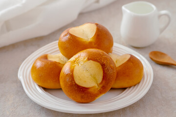 Pretzel buns on white plate