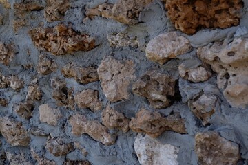 Texture of wall made by lots of stones, wall background