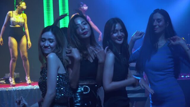 group of diversity sexy woman dancing in night club