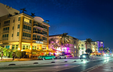 Miami Beach, Florida - July 8, 2024: Lively scene on Ocean Drive in South Beach. The Fritz Hotel on...