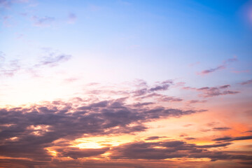 Obraz premium Beautiful , luxury soft gradient orange gold clouds and sunlight on the blue sky perfect for the background, take in everning,Twilight, Large size, high definition landscape photo