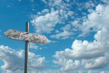 Metallic empty blank crossroad signpost mockup against blue sky and clouds