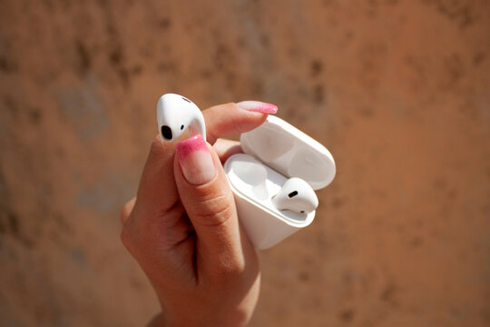 heand holding earphones