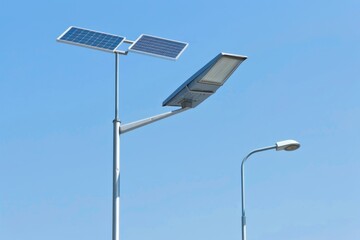 Solar street lamp, each street lamp is installed with two solar panels, blue sky, white background