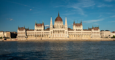 Fototapeta premium Sailing in front of the iconic Hungarian Parliament Building while ncruising the Danube river. Budapest, Hungary