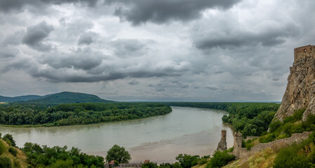 Ruins of the Devin Castle and the famous Maiden tower at the stunning confluence of the Danube and...