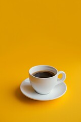 Obraz premium A steaming cup of coffee placed on a white saucer, set against a striking yellow background, evoking warmth and energy.
