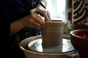 potter ceramics work on a potter's wheel sculpting process beautiful hands