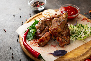 Grilled meat chucks on wooden platter summer bbq food