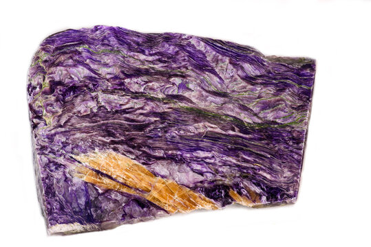 A sample of the charoite stone on a white background. Charoite is a purple colored mineral. Isolated breccia.