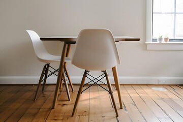 Modern Minimalist Dining Space with Stylish Chairs and Natural Light