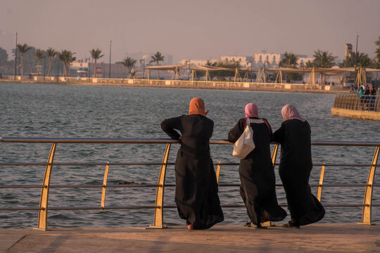 Three covered Muslim women in Islamic clothes on the Jeddah waterfront (Al Hamra Corniche) in Saudi Arabia.
