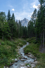 Melting river from Sorapis lake, Dolomite Mountains, Italian Alps, Italy