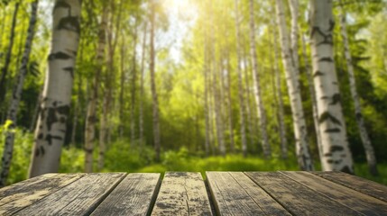 Fototapeta premium close up of empty wooden table with blurred birch forest background
