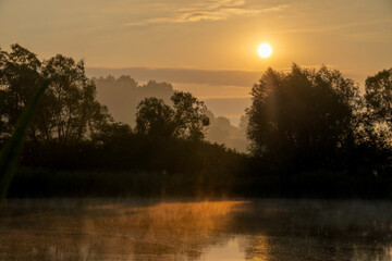 Colors of the sunrise over the pond 