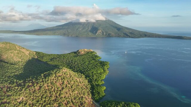 Morning light illuminates the scenic island of Pulau Lembata, between Alor and Flores, Indonesia. This beautiful and biodiverse area is part of the famed Ring of Fire and is volcanically active.