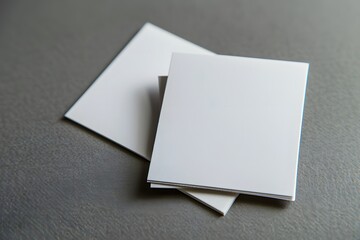 Blank White Cards on a Gray Surface