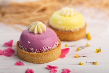 Cute sweet delicious cupcake on desk on pastel background
